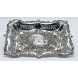 An Edwardian rectangular silver and pierced shallow dish, decorated with embossed flowers and