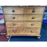 A Victorian mahogany chest fitted with two short and 3 long drawers, on bun feet. Width 108cm