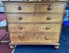 A Victorian mahogany chest fitted with two short and 3 long drawers, on bun feet. Width 108cm