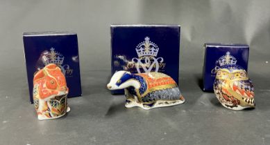 Royal Crown Derby, 'Red Squirrel' gold stopper, 'Little Owl' gold stopper and 'Moonlight Badger'