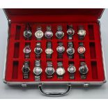 A suitcase containing a collection of 18 various West End Watch Co. midsize wristwatches various