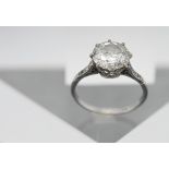 A large diamond ring set, with six smaller diamonds to the shoulders, size L/M, hallmarked rubbed.