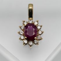 A 14ct yellow gold ruby and diamond pendant.