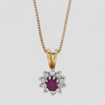 An 18ct yellow gold diamond and ruby pendant on a 9ct gold chain.