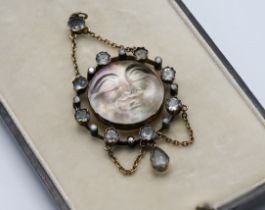 A rare aquamarine and diamond 'man in the moon face' pendant necklace.