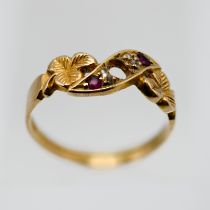 An antique 18ct ruby and diamond ring, with clover leaf design, set in yellow gold, size K.
