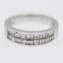 Iliana- an 18k white gold and diamond channel set ring, approx. 7.2g, size O.