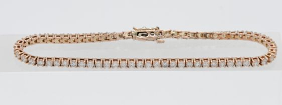 A 14ct rose gold diamond line bracelet, approx. 4ct, approx. 20cm length.