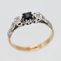 An 18ct and platinum sapphire and diamond set ring, size M.