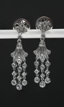 A good pair of diamond, fleur de lys earrings, set in 18ct white gold, length 32mm