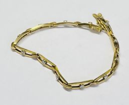 A gold and diamond set bracelet (indistinct hallmark), approx. 13g.