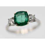 A diamond and rectangular cushion shape emerald three stone ring, the approx. weight of the