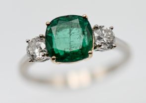 A diamond and rectangular cushion shape emerald three stone ring, the approx. weight of the