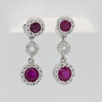 A pair of 18ct white gold diamond and ruby drop earrings.