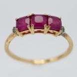 A silver ring set with African ruby and diamond, asscher cut stones and baguette diamonds, gold