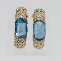 A pair of 14ct gold topaz and diamond earrings.