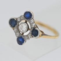 An 18ct gold fancy diamond and sapphire ring set with nine round brilliant cut diamonds and four cut