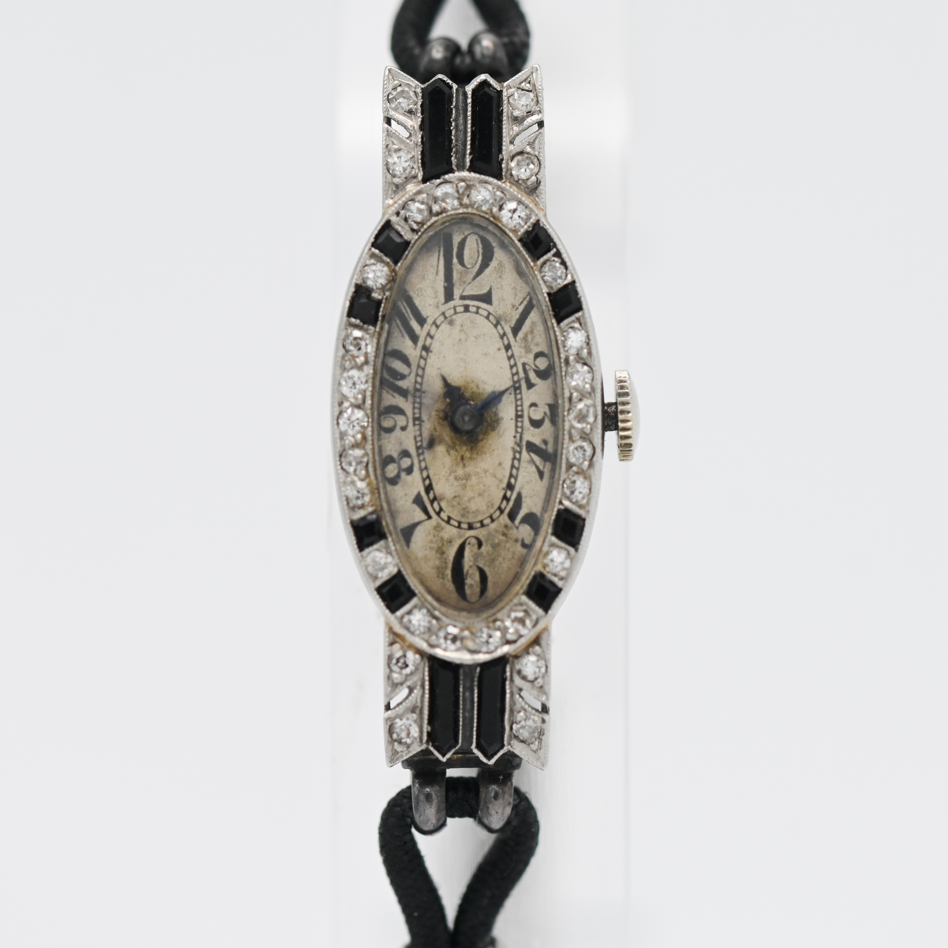 An antique diamond and onyx set ladies cocktail watch.