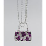 Iliana- an 18k white gold ruby and diamond pendant in the form of a bag, approx. 9.6g, with