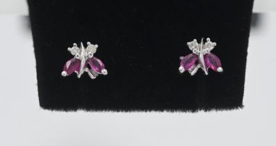 A pair of 18ct white gold and diamond 'Butterfly' style studs.