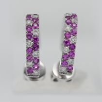 A pair of 18ct white gold diamond and pink sapphire hoop earrings.