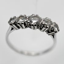 A fine diamond five stone ring, set in white gold or platinum (unmarked), size N.