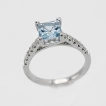 An 18ct white gold aquamarine and diamond ring, size N.
