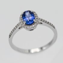 An 18ct white gold diamond and sapphire ring, size N.