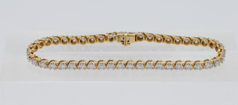 An 18ct yellow gold bracelet set with 46 round brilliant cut diamonds, colour I, clarity I1, total