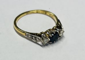 An 18ct yellow gold diamond and sapphire ring, size N/O.