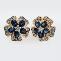 A pair of 14ct diamond and sapphire 'flower' style studs.