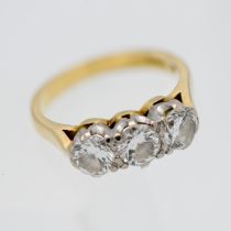 An 18ct three stone diamond ring, size J