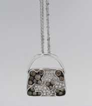 Iliana - an 18k white gold and diamond set pendant in a form of a bag, approx. 9.4g with receipt.