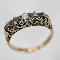 An 18ct five stone diamond ring set with old cut diamonds, size M/N.