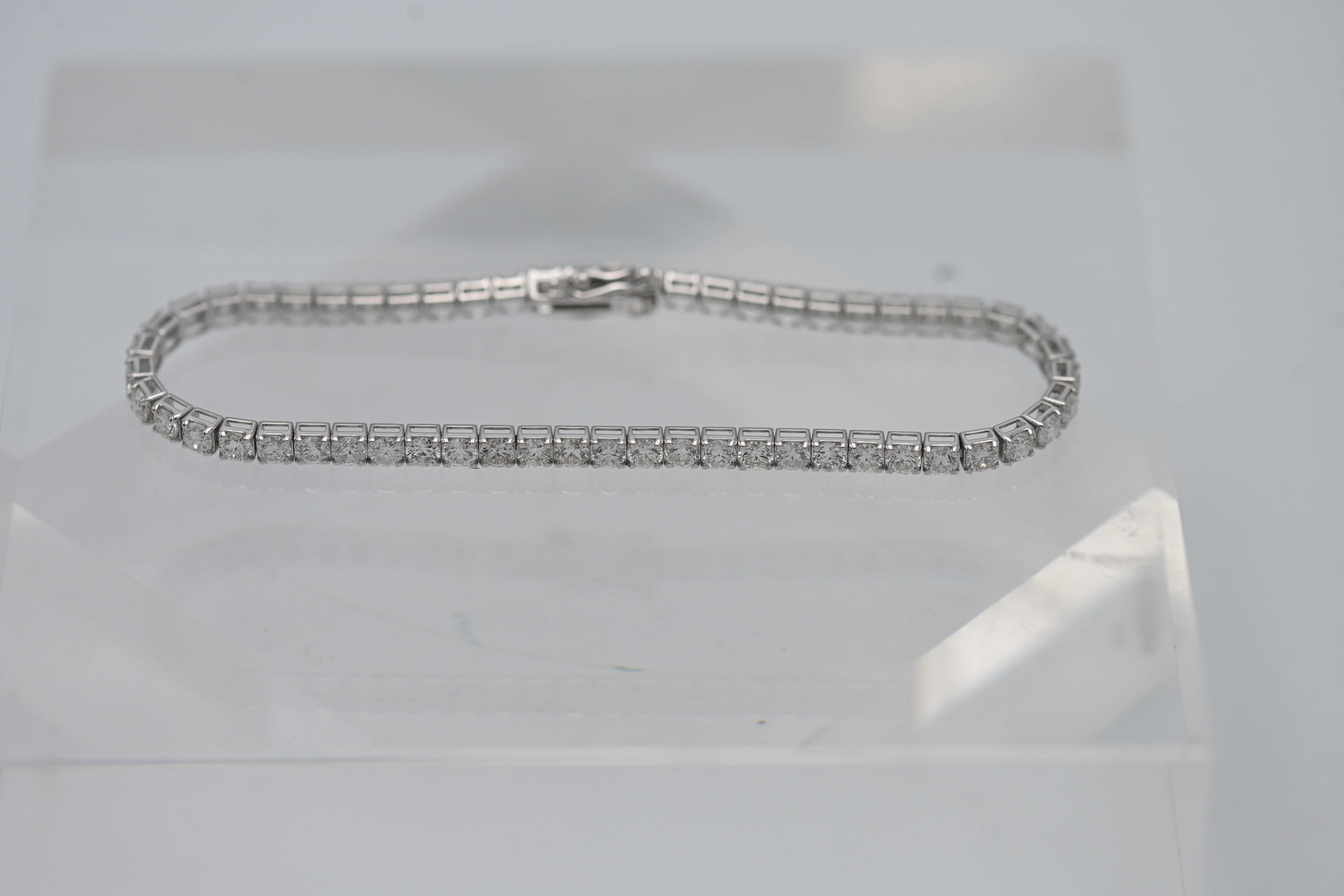 An 18ct white gold diamond line bracelet, diamond weight approx 5.64ct , set with approx fifty six