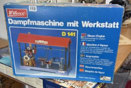 An original Wilesco D141 live steam engine workshop. Horizontal steam engine with pressure gauge,