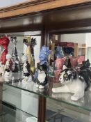 A collection of ornamental cats incl Sylvac, Winstanley, Jenna, Carl Scheidegg, Jemma Holland,