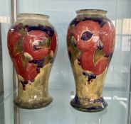 William Moorcroft- two similar baluster shaped Pomegranate vases, signed in green, height 23cm/22.