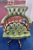 A green leather upholstered 'captains' office swivel chair