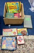 A collection of various vintage games, including Chinese checkers, scrabble etc.