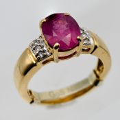 An 18ct yellow gold ruby and diamond ring, size I (with size inserter).