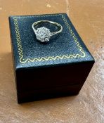 An 18ct gold diamond cluster ring, approx 1.8g, size P.