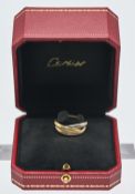Cartier, an 18ct three tone gold trilogy ring with cartier certificate, number 075397 dated May