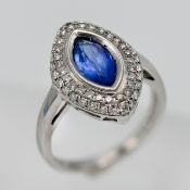 An 18ct diamond and tanzanite marquise shaped ring, size O.