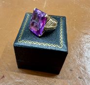 A large amethyst and gold set ring, marked ZEE, approx 11.1g, size J.