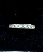 An 18ct gold diamond half eternity ring, approx 3.5g, size Q/R.
