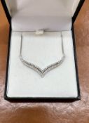 A 9ct white gold and diamond set modern necklace, stamped 1.00, approx 4.8g.