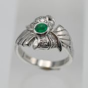 An 18ct white gold stylish emerald and diamond set ring, size M.