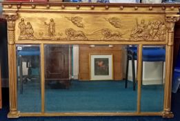 A large 19th century gilt frame mantle mirror, decorated with a classical imagery and Corinthian