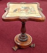 A Victorian embroidered occasional table depicting a man and a woman on horseback, mahogany,